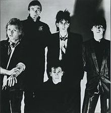 The Cars, 1984. L–R: Benjamin Orr, Greg Hawkes, David Robinson, Ric Ocasek, and Elliot Easton.